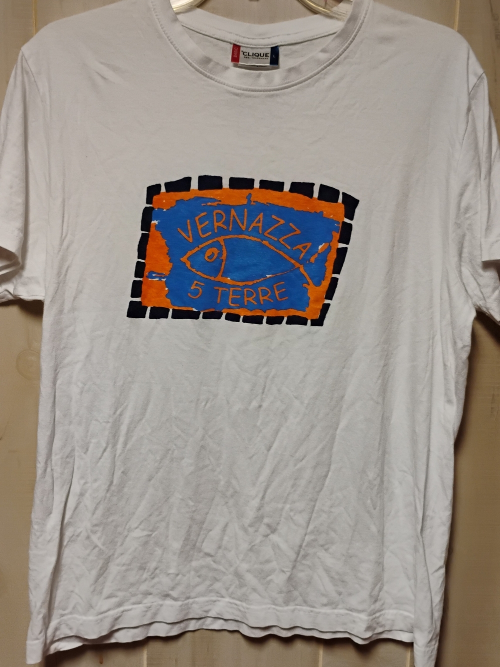 Clinique White T-Shirt with Blue and Orange Vernazza Graphic